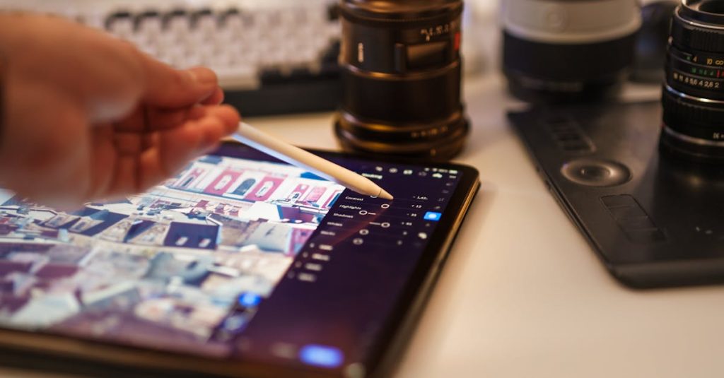 A detailed view of a professional photography editing setup with tablet and lenses.